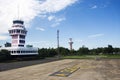 Air Traffic Control tower and Small plane stop on runway at Ubon Ratchathani International Airport Royalty Free Stock Photo