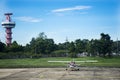 Air Traffic Control tower and Small plane stop on runway at Ubon Ratchathani International Airport Royalty Free Stock Photo