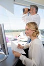 air traffic controllers at work in flight control tower