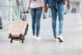 Air Transportation. Cropped Image Of Black Couple Walking With Luggage In Airport