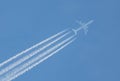 Air travel contrails Royalty Free Stock Photo