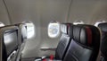 Air travel experience with empty plane seats and window views for vacation and travel design Royalty Free Stock Photo