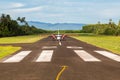 Air travel in Fiji, Melanesia, Oceania. A small propeller airplane just landed to a remote airstrip. Levuka town, Ovalau island.