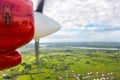 Air travel in Fiji, Melanesia, Oceania. View of Rewa river, Nausori town, Viti Levu island from a window of a small airplane.