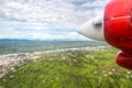 Air travel in Fiji, Melanesia, Oceania. View of Rewa river, Nausori town, Viti Levu island from a window of a small red airplane.