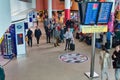 Air travellers check the flight departure information on large video screens in a lounge at Manchester`s Ringway Airport