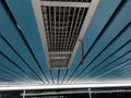 Air Ventilation Grille on Modern Blue Ceiling with Red Maintenance Tag Royalty Free Stock Photo