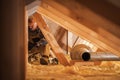 Air Ventilation Installer Working in Attic Royalty Free Stock Photo