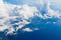 Air view from the plane window of the mountainous coastline of Taiwan among the clouds Royalty Free Stock Photo