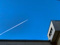 Air white footprint from the plane against a clear blue sky Royalty Free Stock Photo