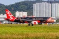 AirAsia Airbus A320 airplane at Penang Airport in Malaysia De\'Xandra special livery