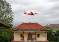 AirAsia Airbus A320 passing over the Hindu temple