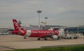 AirAsia airplane docking at Changi airport in Singapore