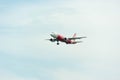 AirAsia Airplane Landing at Singapore Changi International Airport, Singapore, April 2018 Royalty Free Stock Photo