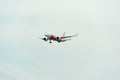 AirAsia Airplane Landing at Singapore Changi International Airport, Singapore, April 2018 Royalty Free Stock Photo