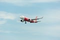 AirAsia Airplane Landing at Singapore Changi International Airport, Singapore, April 2018 Royalty Free Stock Photo