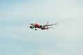 AirAsia Airplane Landing at Singapore Changi International Airport, Singapore, April 2018 Royalty Free Stock Photo