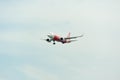 AirAsia Airplane Landing at Singapore Changi International Airport, Singapore, April 2018 Royalty Free Stock Photo