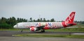 AirAsia airplane on runway at the airport in Kalibo, Philippines Royalty Free Stock Photo