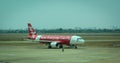 AirAsia airplane on the runway at Tan Son Nhat airport, Saigon, Vietnam