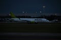 AirBaltic airline Airbus A220-300 aircraft on the runway of Riga International Airport at night. Riga International Airport,