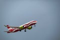 AirBaltic airline Airbus A220-300 in the colors of the Latvian national flag against the background of the sky. Riga International