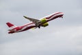 AirBaltic airline Airbus A220-300 in the colors of the Latvian national flag against the background of the sky. Riga International