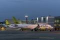 AirBaltic airline planes are parked at Vilnius International Airport. Airport at dusk. Exit to the runway