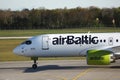 AirBaltic jet plane taxiing in airport