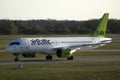 AirBaltic jet plane taxiing in airport