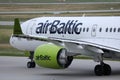 AirBaltic jet plane taxiing in airport