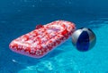 Airbed and Water Ball in Swimming Pool Royalty Free Stock Photo
