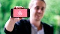 COLOGNE, GERMANY - May 06, 2018: Closeup of young man holding white iPhone with AIRBNB LOGO on screen Royalty Free Stock Photo