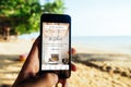 KRABI, THAILAND - MARCH 06, 2018: Closeup of iPhone Screen with AirBNB PLUS Startscreen at a Beach Royalty Free Stock Photo