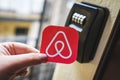 Airbnb logo next to a key lock box