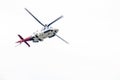 Airborn Helicopter Isolated Against White Overcast Sky Royalty Free Stock Photo