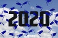 Blue 2020 graduations caps in sky