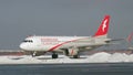 Airbus A320 of Air Arabia taxiing in Moscow airport, winter view
