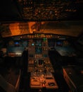 Airbus A319 aircraft illuminated interior without pilots at night