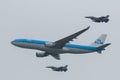 Airbus A330 of the KLM escorted by two F-16 of the Royal Dutch Airforce