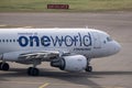 An Airbus A319 on Oneworld Alliance livery, operated by Finnair, taxiing at Helsinki Airport