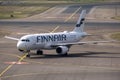 An Airbus A320, operated by the Finnish flag carrier Finnair, taxiing at Helsinki Airport