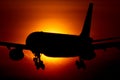 Airbus A330 passenger airplane crossing the sun Royalty Free Stock Photo