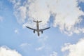 Airbus A320 plane of Lufthansa airline viewed from a low angle and from behind just after take off in a blue sky