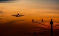Airbus 320 silhouette on sunset landing on airport