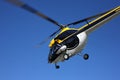 Aircraft - Black-yellow helicopter flight at low height Royalty Free Stock Photo