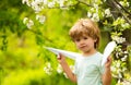 Aircraft. Cheap flights. Traveling with children. The boy holds paper airplanes. Low cost flights. Vacations and Royalty Free Stock Photo