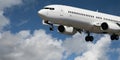 Aircraft closeup in flight with cumulus cloud in blue sky. Australia. Royalty Free Stock Photo