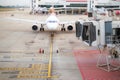 Aircraft docked to a jetway at the airport