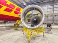 Aircraft engine close-up with service platform inside hangar during inspection Royalty Free Stock Photo